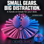 Pink and blue 3D-printed plastic gear ball close-up